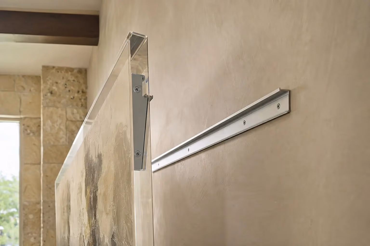 Acrylic artwork lifted away from the wall to reveal two interlocking aluminium French cleat rails